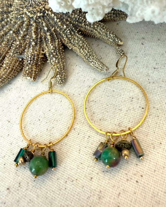 Gold hoop earrings with green beads 